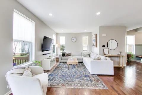 a view of a dining room with furniture window and wooden floor