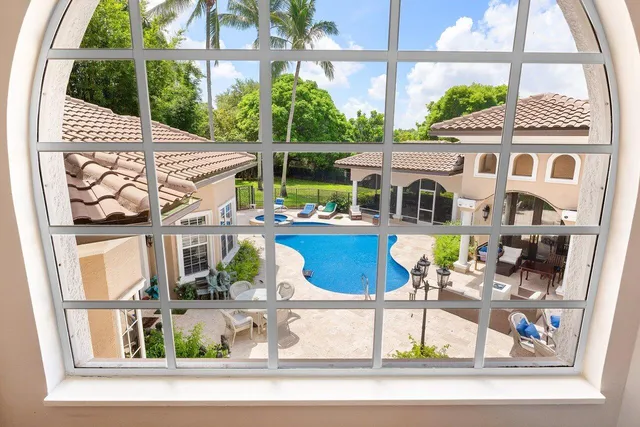 an aerial view of a house with garden space and street view