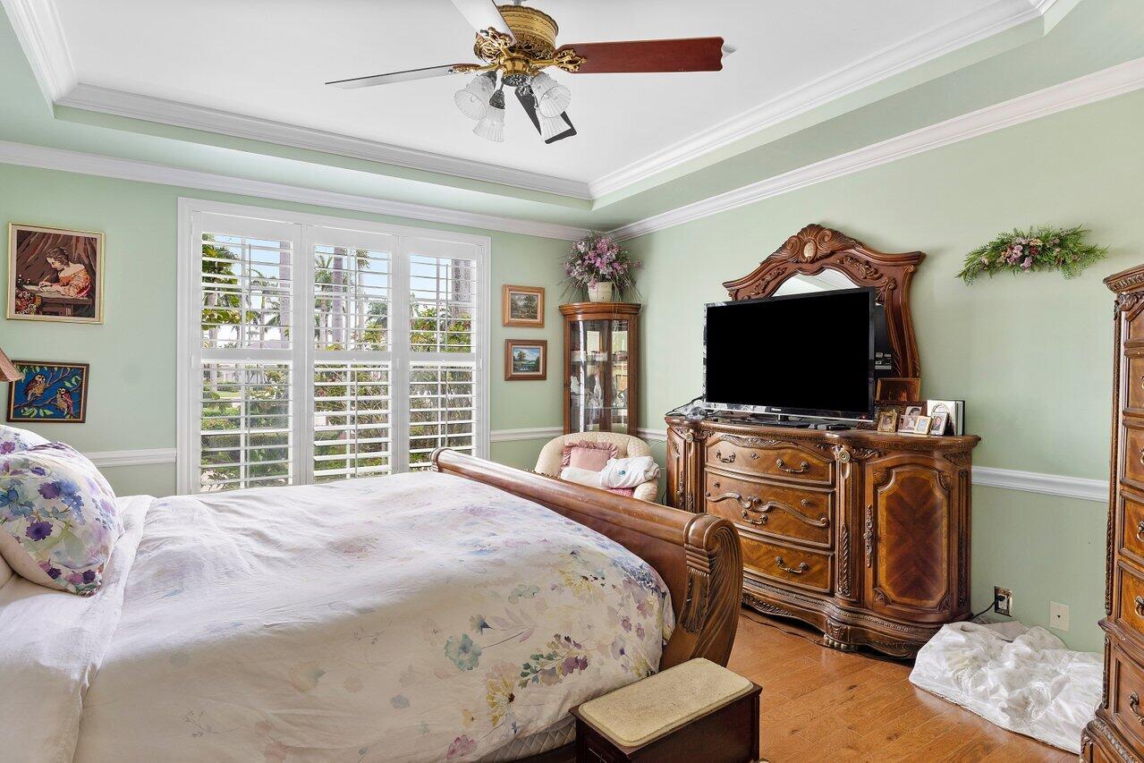 16467 Brookfield Estates Way Delray Beach, FL 33446 - Photo 31 of 78 a bedroom with a bed and a flat screen tv