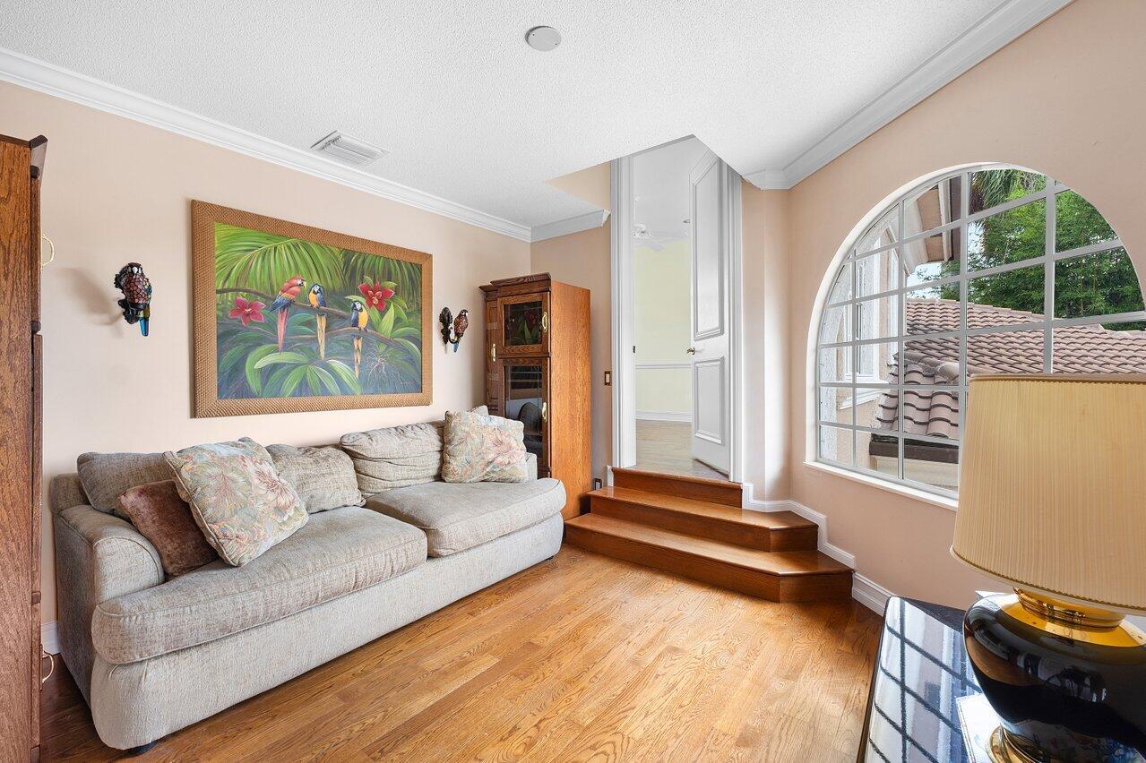 16467 Brookfield Estates Way Delray Beach, FL 33446 - Photo 32 of 78 a living room with furniture and a flat screen tv