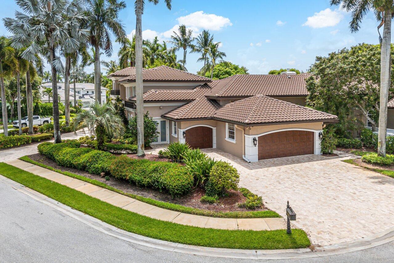 16467 Brookfield Estates Way Delray Beach, FL 33446 - Photo 5 of 78 a front view of a house with a yard garage and outdoor seating
