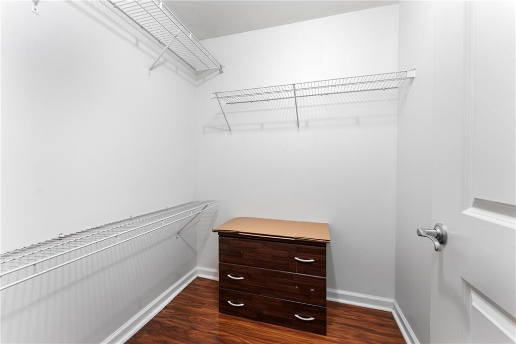 3040 Peachtree Road, Unit 1205 Atlanta, GA 30305 - Photo 11 of 43 a view of a room with racks on the wall