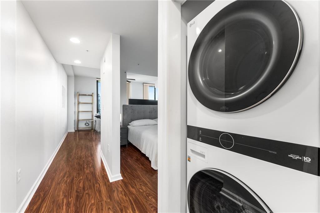 3040 Peachtree Road, Unit 1205 Atlanta, GA 30305 - Photo 12 of 43 a view of a bedroom with washer and dryer
