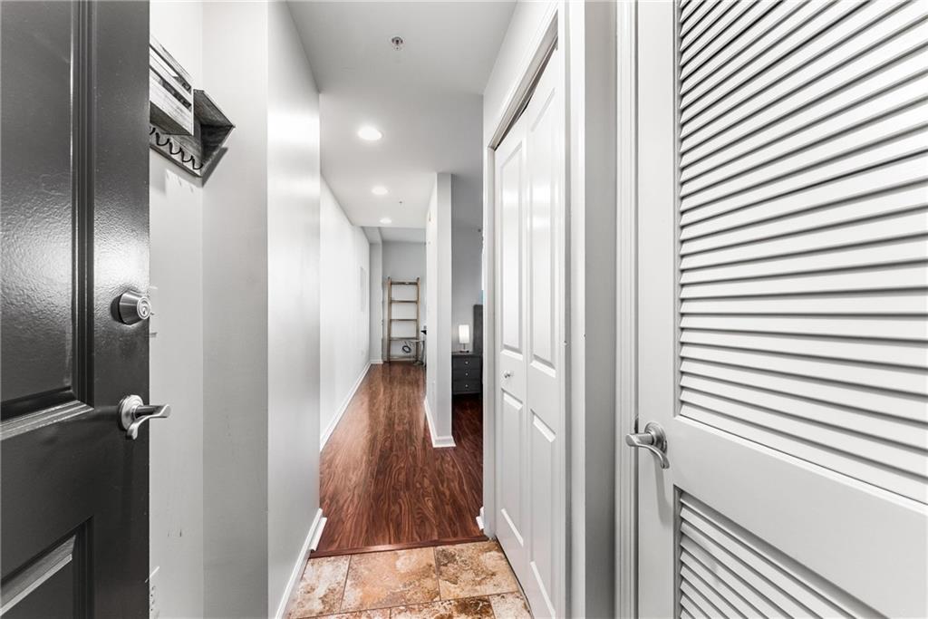 3040 Peachtree Road, Unit 1205 Atlanta, GA 30305 - Photo 13 of 43 a view of a hallway with a white walls
