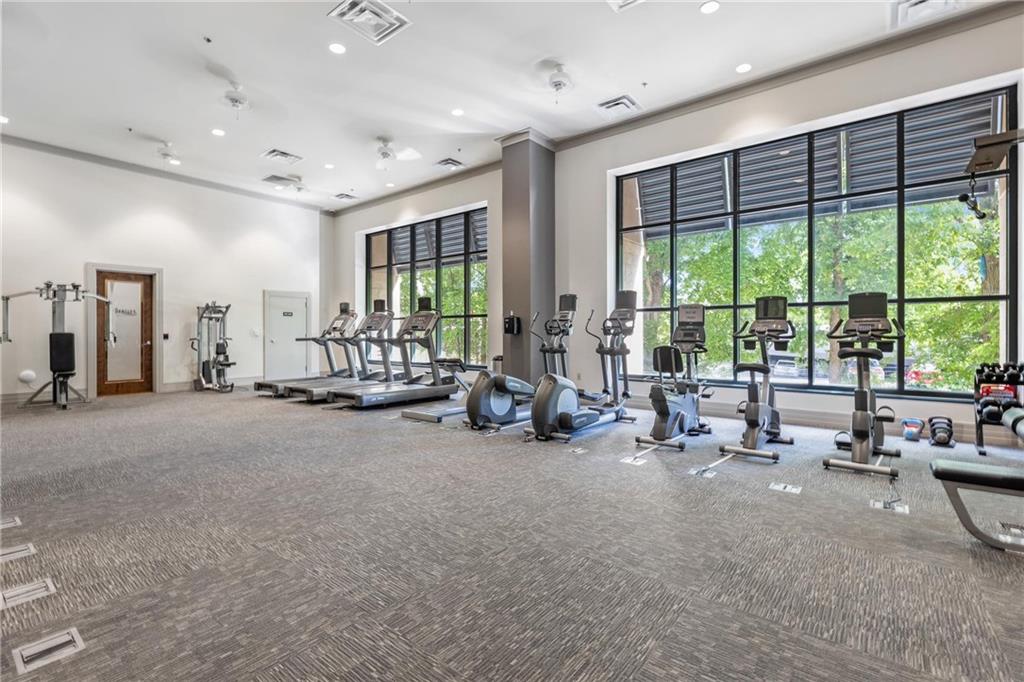 3040 Peachtree Road, Unit 1205 Atlanta, GA 30305 - Photo 17 of 43 a view of a room with gym equipment and large windows