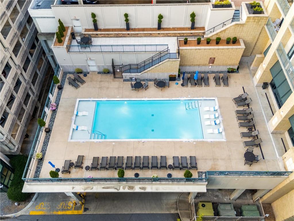 3040 Peachtree Road, Unit 1205 Atlanta, GA 30305 - Photo 22 of 43 a view of a patio with a table and chairs