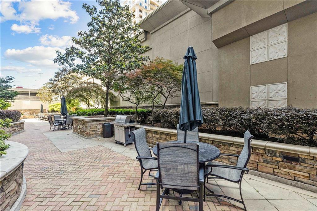 3040 Peachtree Road, Unit 1205 Atlanta, GA 30305 - Photo 24 of 43 a view of a chairs and tables in the patio