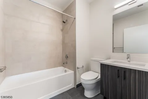 a bathroom with a toilet a sink and a bathtub