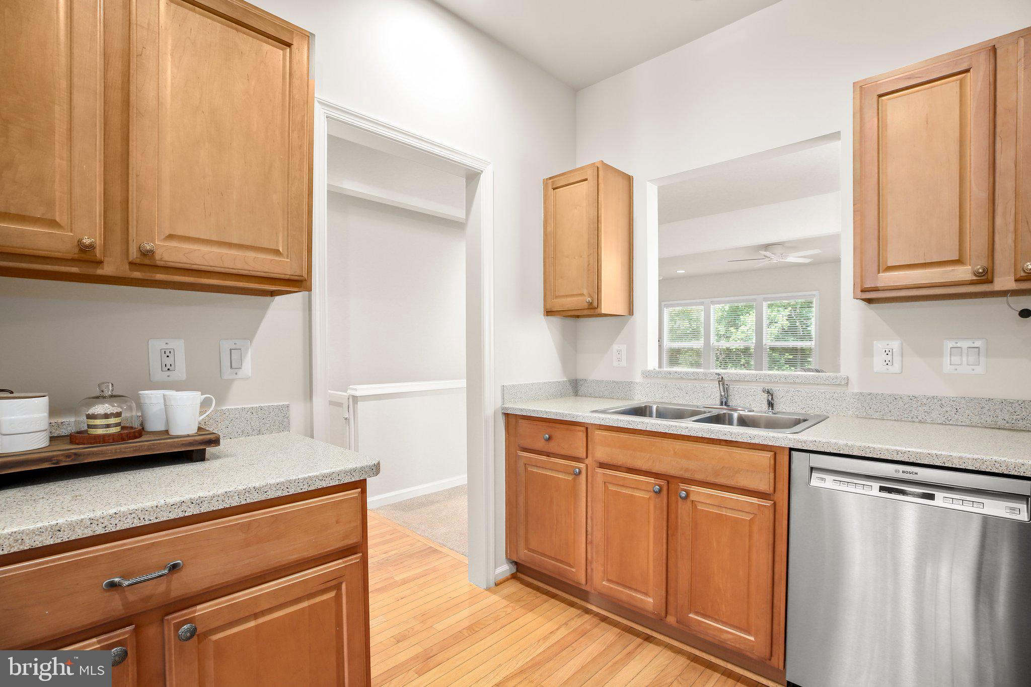 14 Sugargrove Court Fredericksburg, VA 22406 - Photo 11 of 63 a kitchen with stainless steel appliances granite countertop a sink and a white cabinets