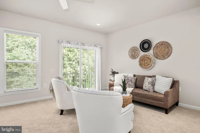 a living room with furniture and white walls