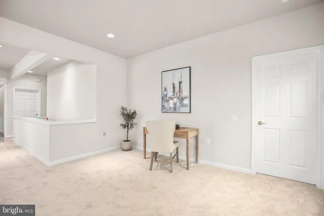 a bedroom with a bed and a lamp