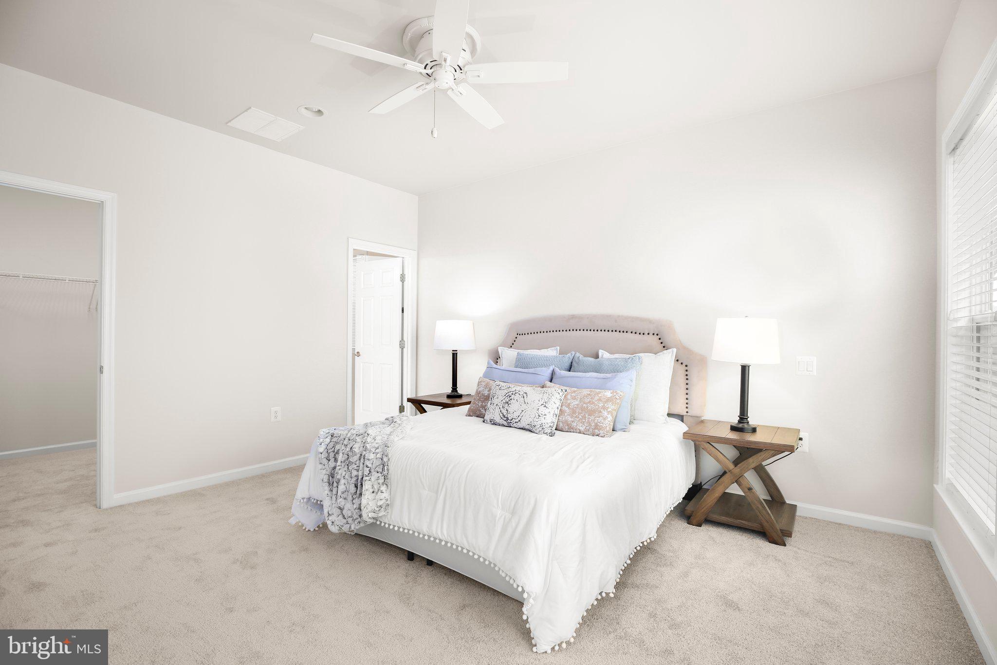 14 Sugargrove Court Fredericksburg, VA 22406 - Photo 22 of 63 a bedroom with a bed and a chandelier