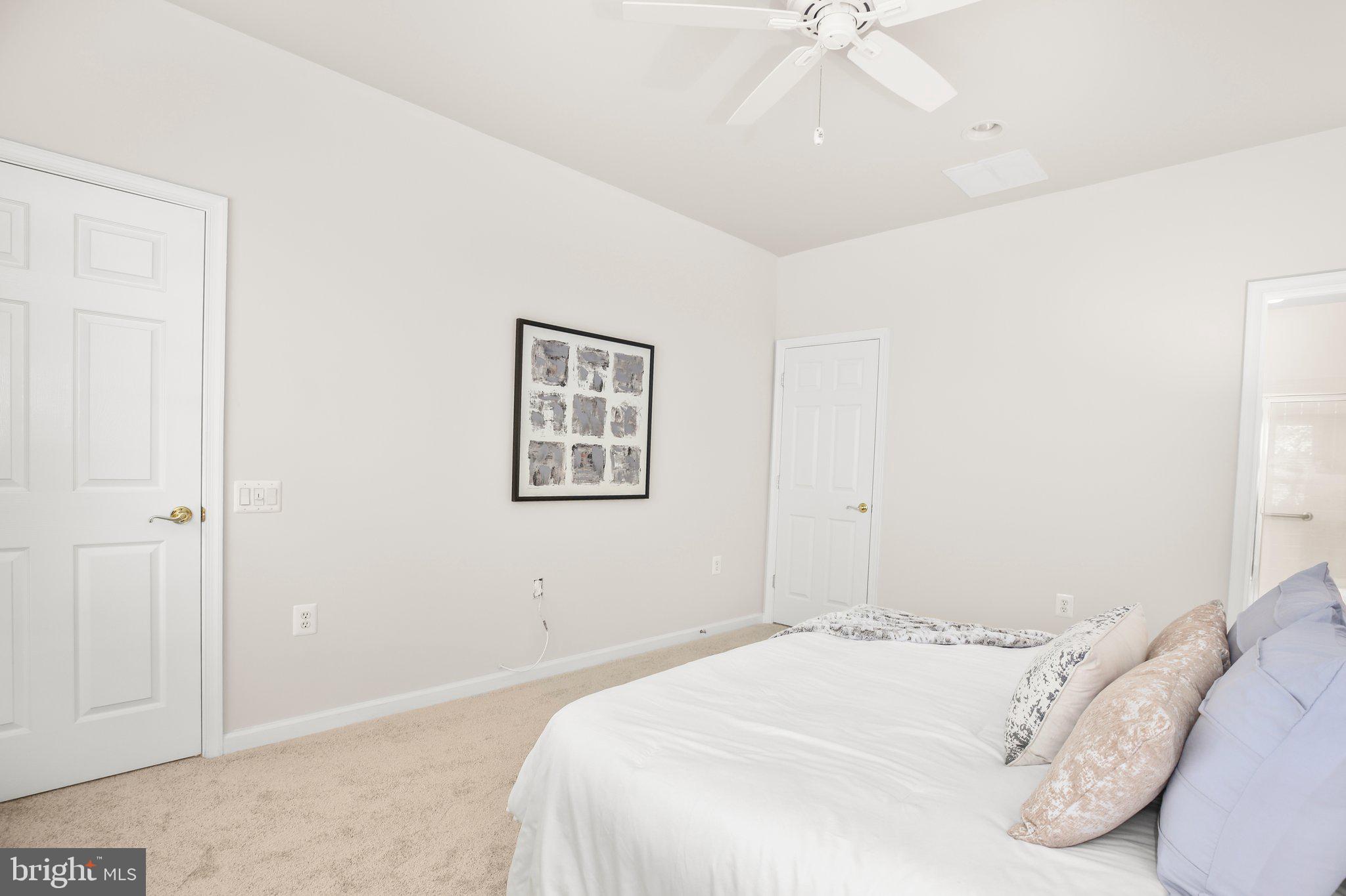 14 Sugargrove Court Fredericksburg, VA 22406 - Photo 23 of 63 a bedroom with a bed and a chandelier