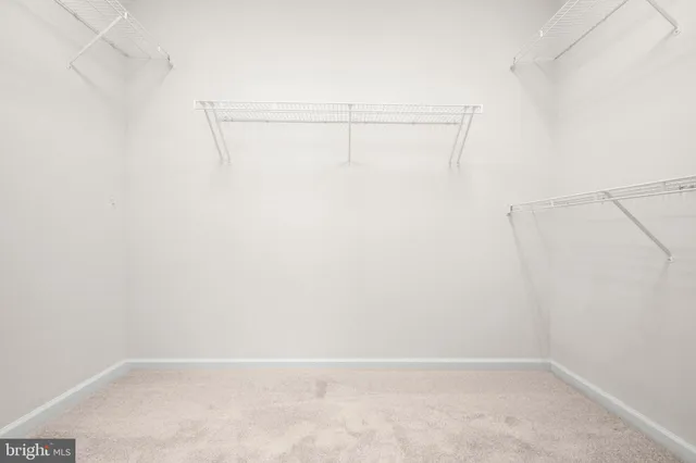 a bathroom with a toilet a sink a mirror a bathtub and vanity