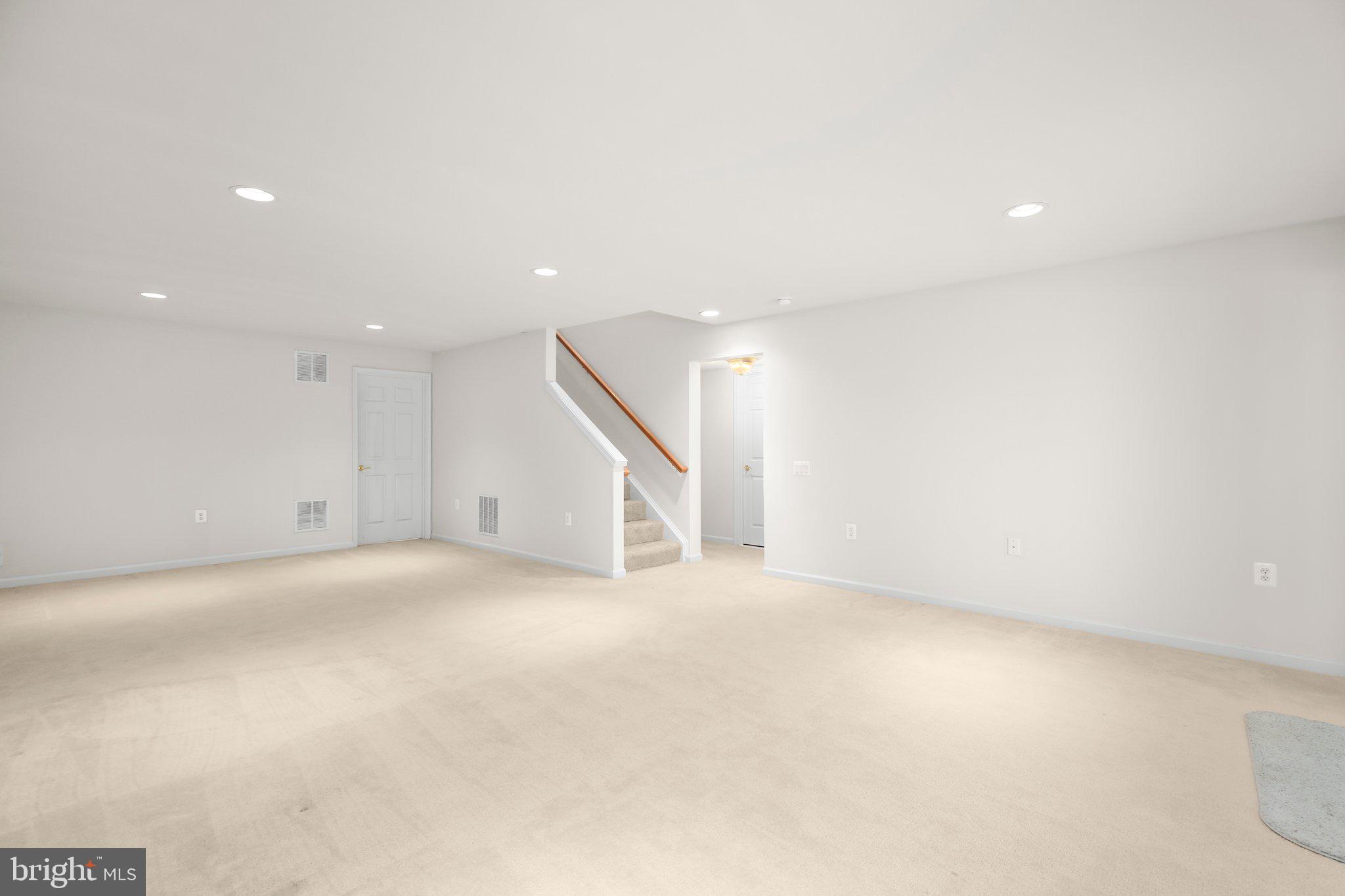 14 Sugargrove Court Fredericksburg, VA 22406 - Photo 31 of 63 an empty room with a ceiling fan and windows