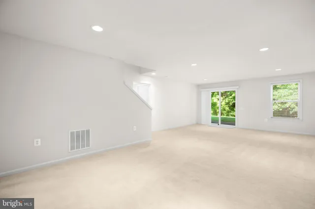 a view of an empty room with storage