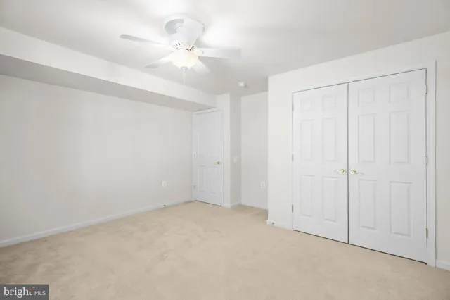 a large building with a big yard and large trees