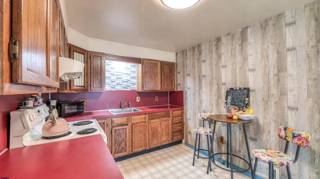 a living room with furniture a rug and a window