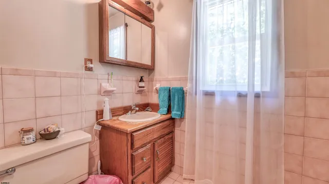 a utility room with dryer washer and a window