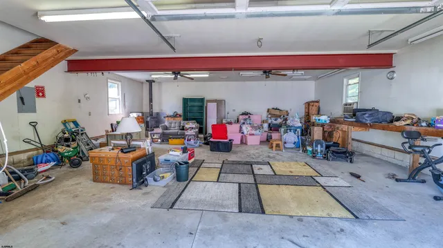 a living room with furniture and a dining table