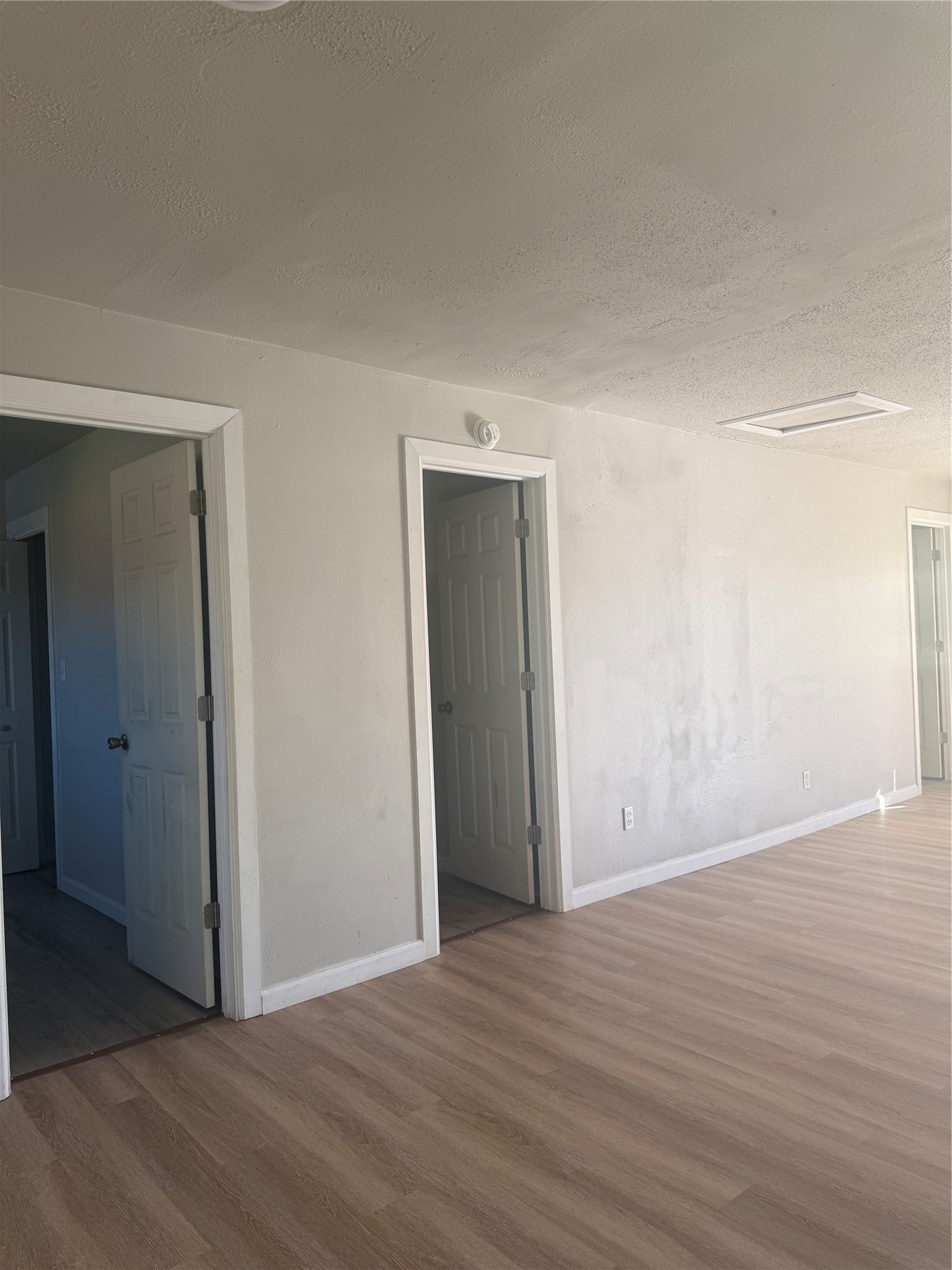 8510 Safeguard Street, Unit 3 Houston, TX 77051 - Photo 13 of 13 a view of an empty room with wooden floor and closet