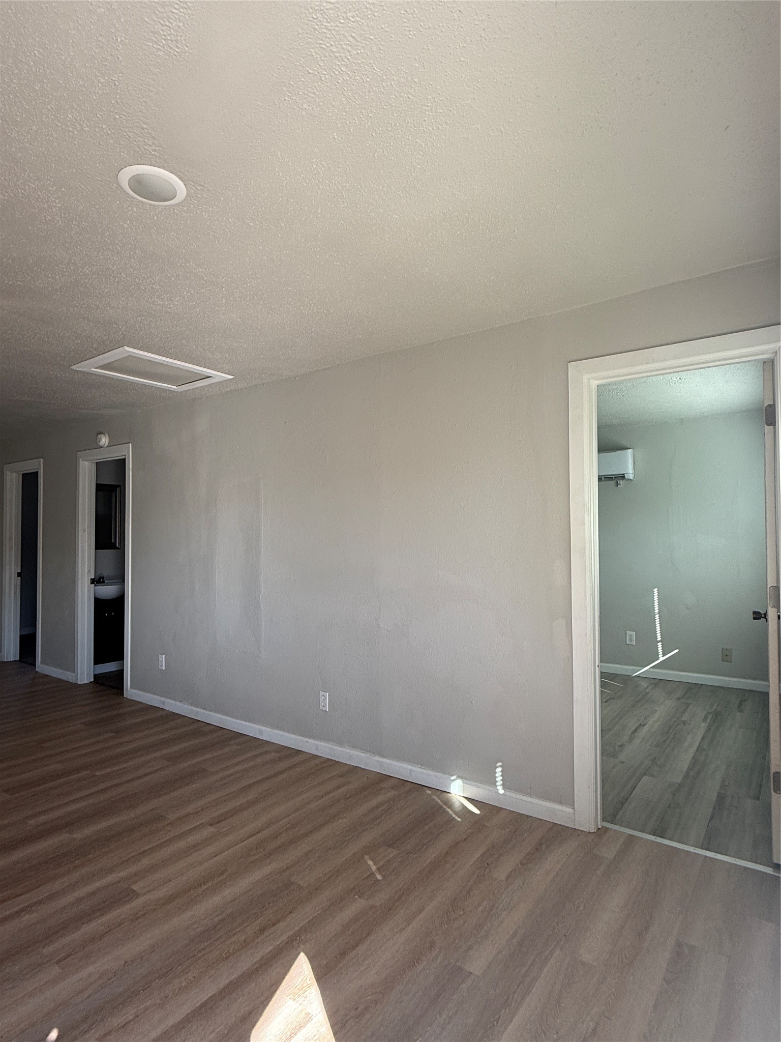8510 Safeguard Street, Unit 3 Houston, TX 77051 - Photo 3 of 13 a view of an empty room with wooden floor