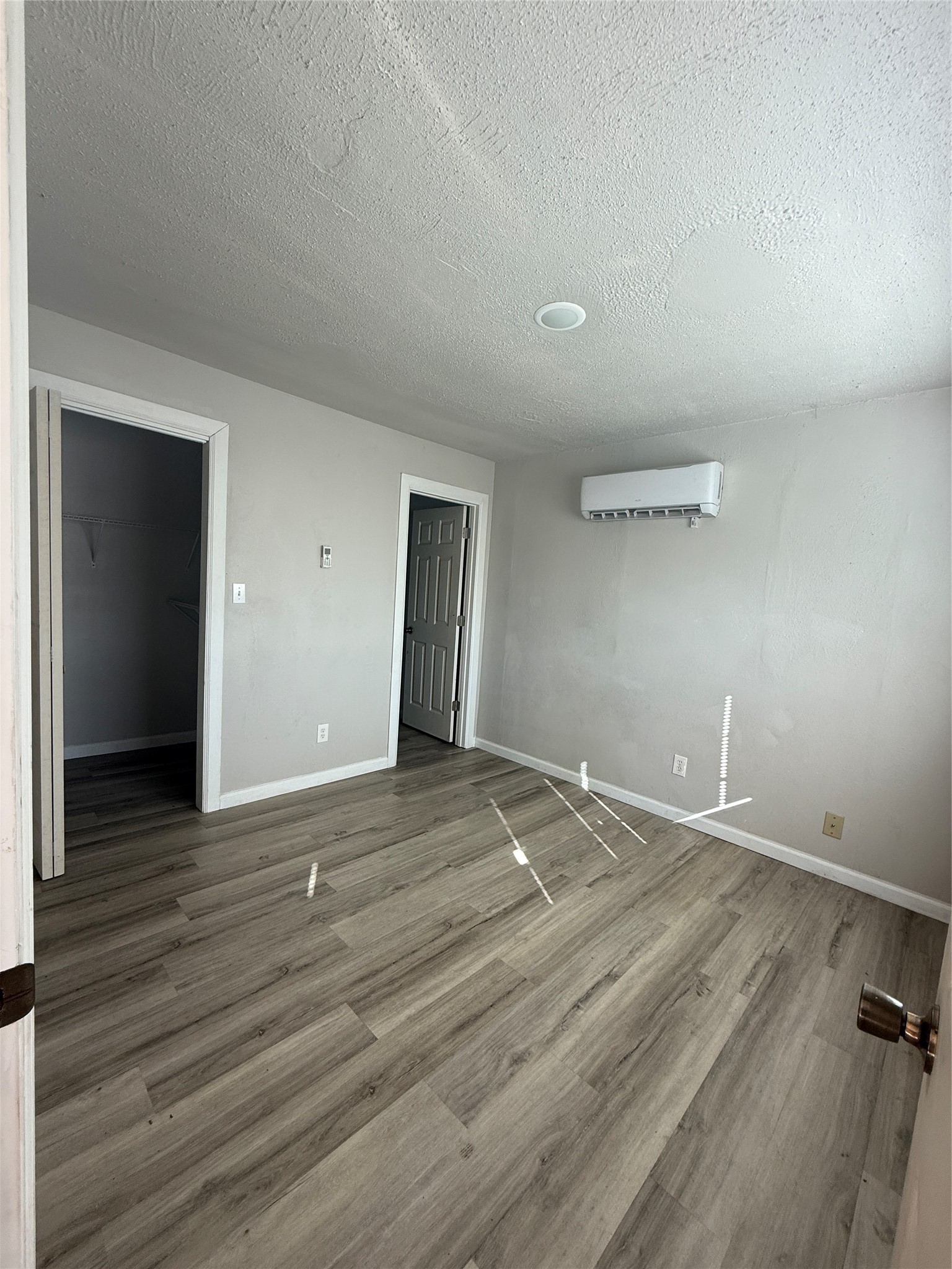 8510 Safeguard Street, Unit 3 Houston, TX 77051 - Photo 4 of 13 a view of an empty room with wooden floor