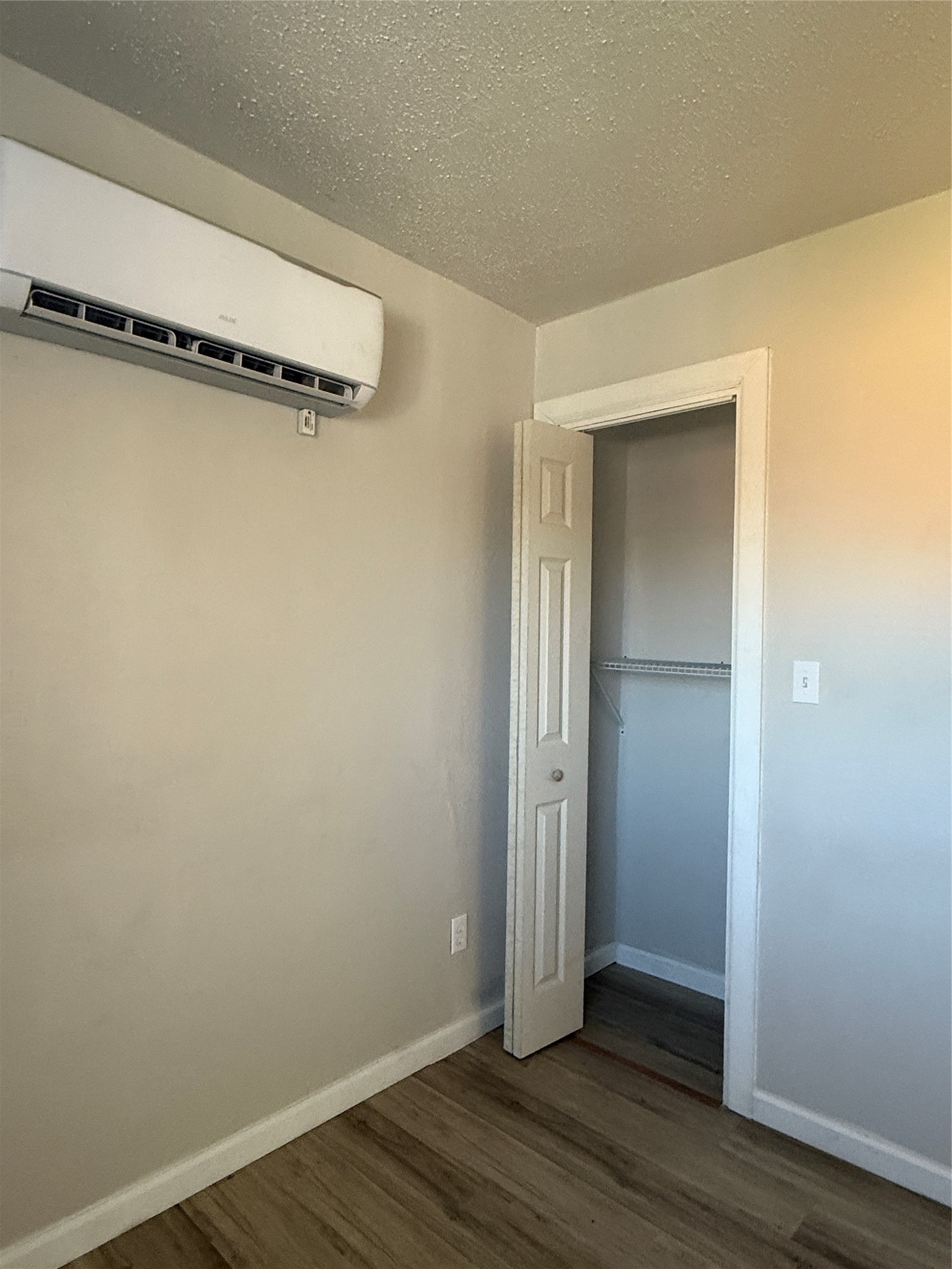 8510 Safeguard Street, Unit 3 Houston, TX 77051 - Photo 9 of 13 an empty room with wooden floor