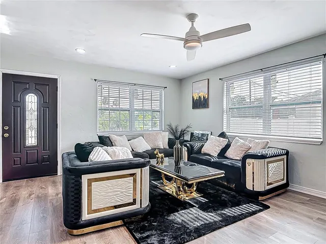 a living room with furniture and a window