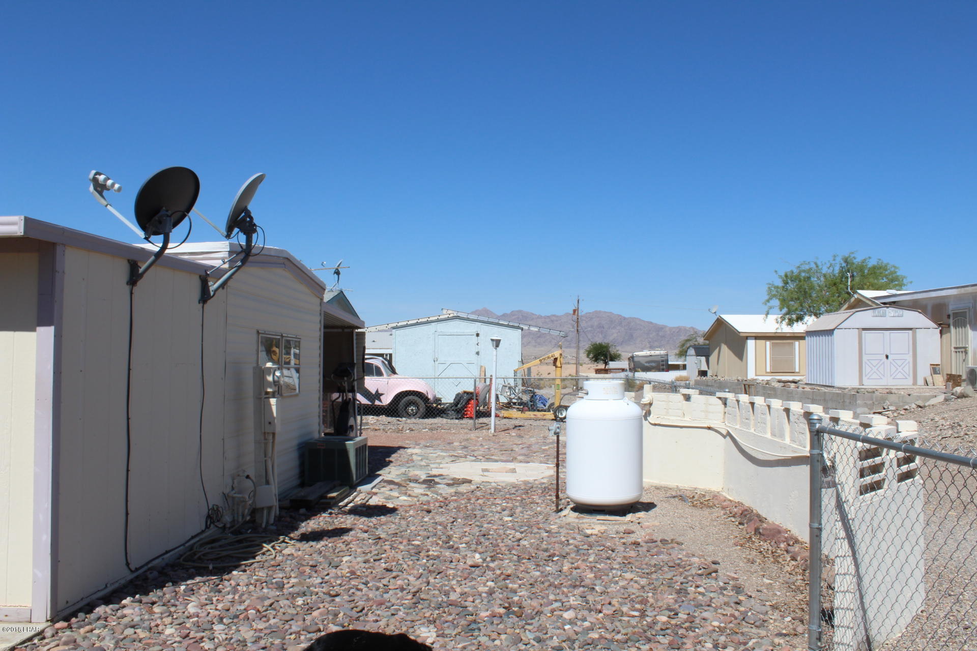 1966 Bayshore Road Lake Havasu City, AZ 86404 - Photo 13 of 22 Backyard with Propane Tank