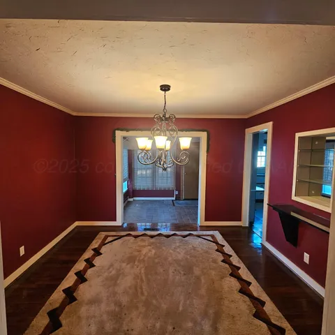 a bed room with a bed and a chandelier