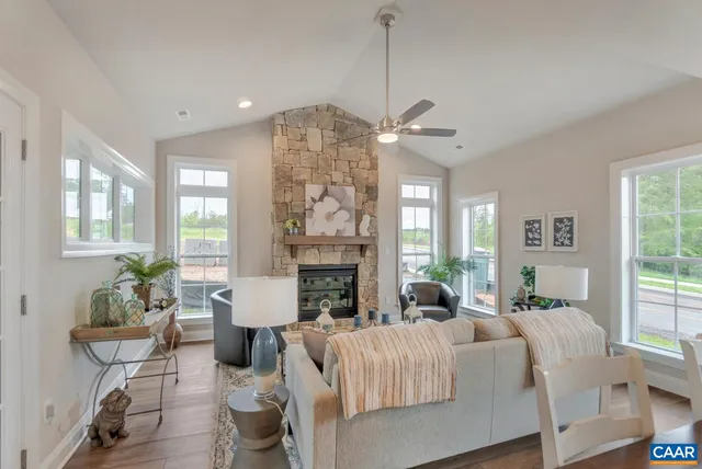 a living room with furniture a chandelier and a chandelier