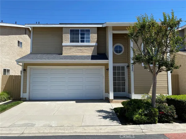 a front view of a house with a garage