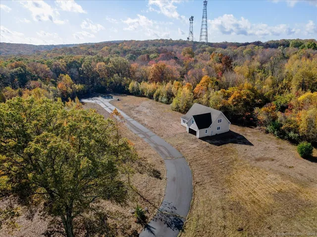 a view of a yard with wooden fence