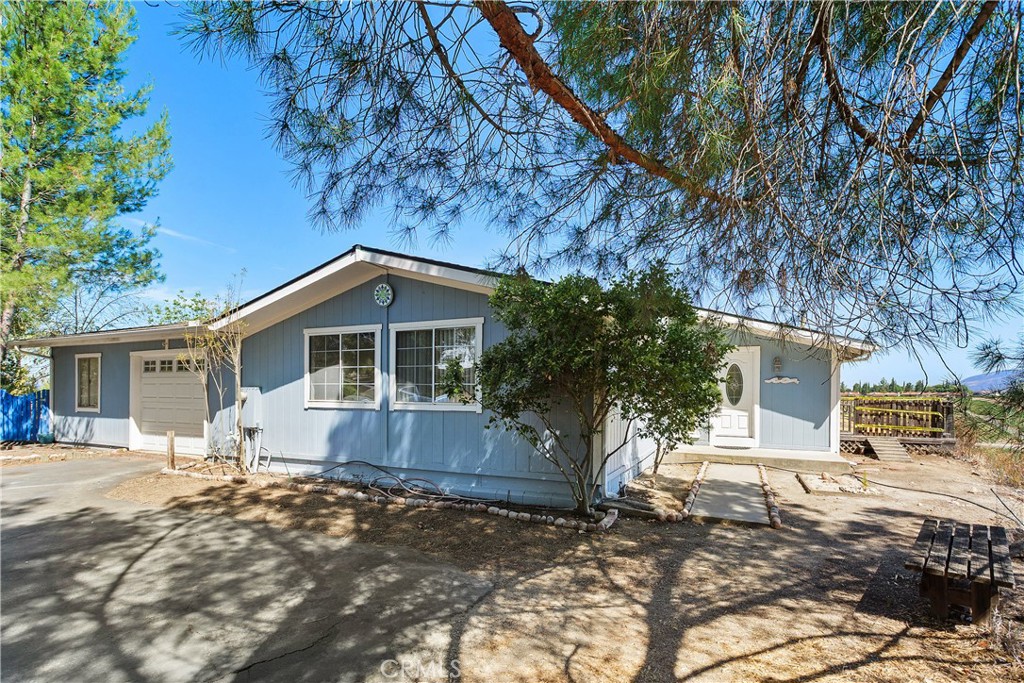 34881 Los Nogales Road Temecula, CA 92592 - Photo 10 of 50 Single story home with attached garage with an additional room. Parking area not shown is ample!