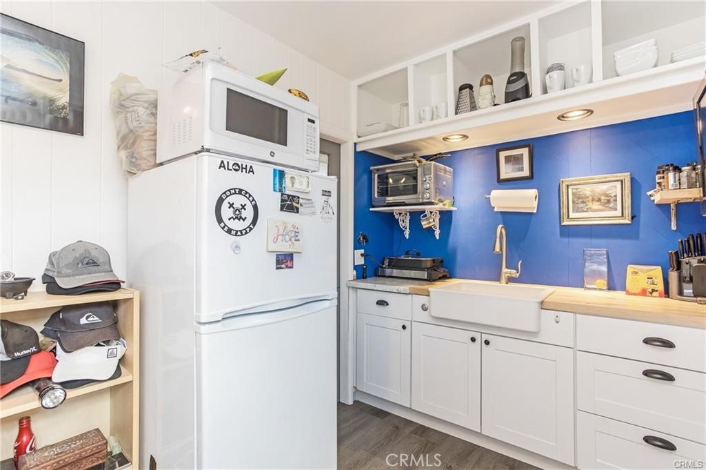 31711 Fairview Road Laguna Beach, CA 92651 - Photo 15 of 20 a kitchen with a refrigerator a stove and cabinets