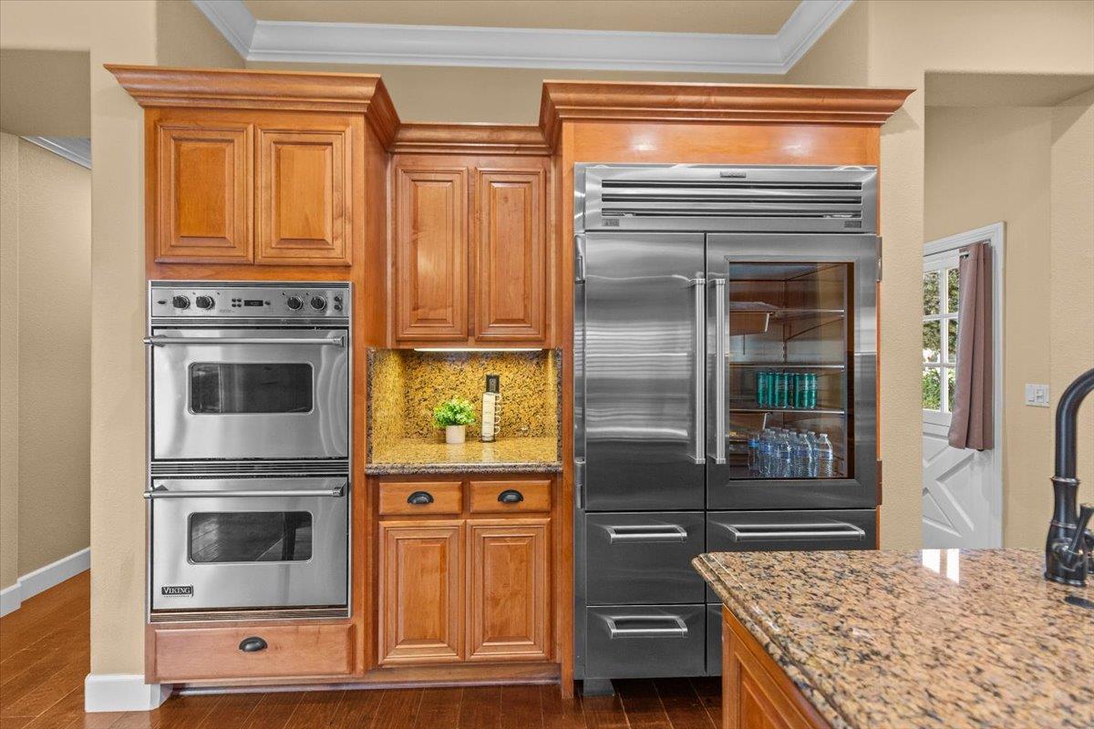 3168 Hutton Place Tracy, CA 95377 - Photo 16 of 94 a kitchen with stainless steel appliances granite countertop a stove and a refrigerator