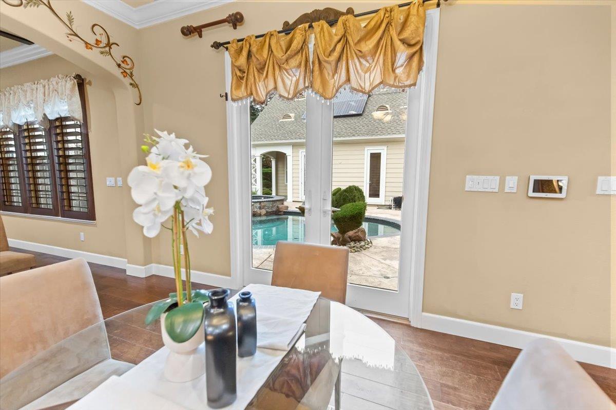 3168 Hutton Place Tracy, CA 95377 - Photo 27 of 94 a living room with furniture and a chandelier