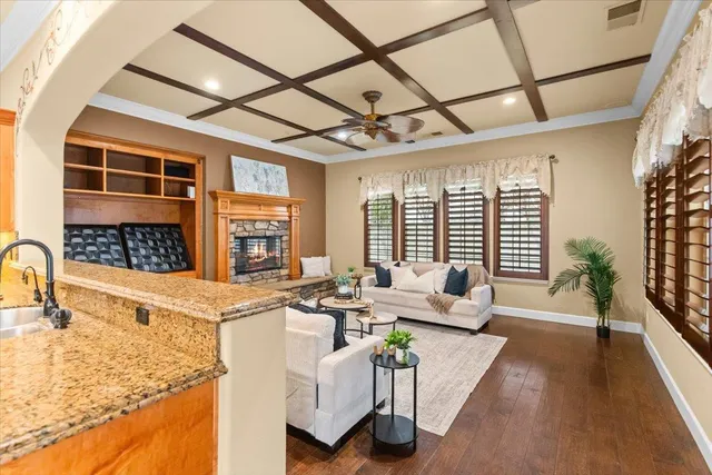 a view of a kitchen with wooden floor and cabinets