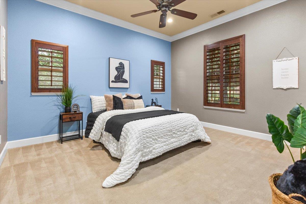3168 Hutton Place Tracy, CA 95377 - Photo 35 of 94 a bedroom with a large bed and a window