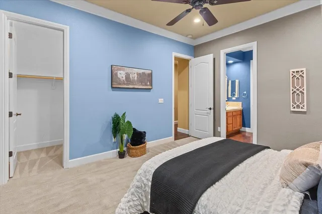 a kitchen with stainless steel appliances granite countertop a refrigerator a stove and a sink with cabinets