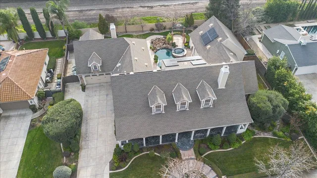 front view of a brick house with a yard