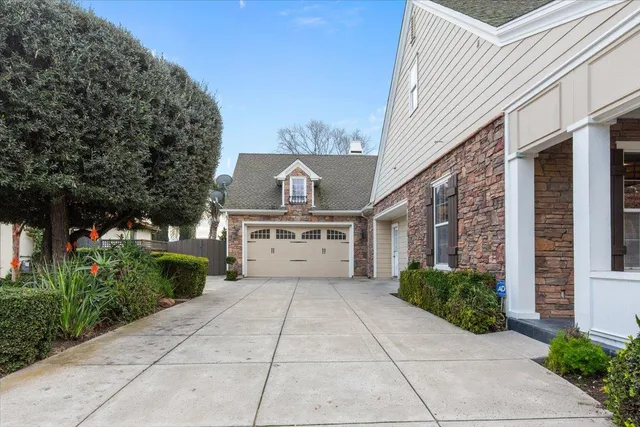 a view of a dining room with furniture wooden floor and chandelier