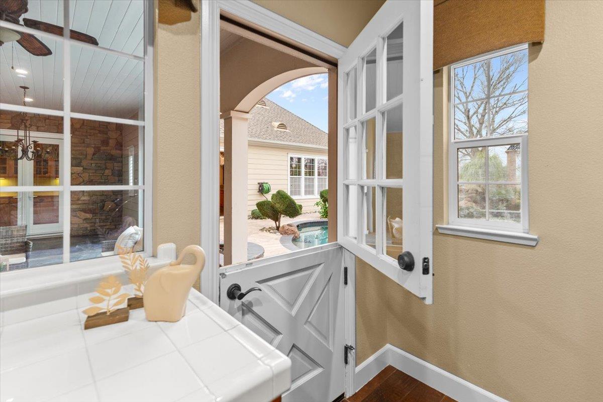 3168 Hutton Place Tracy, CA 95377 - Photo 57 of 94 a view of an entryway with wooden floor and a window