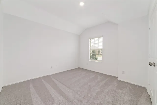 a view of a hallway with wooden floor and a hallway