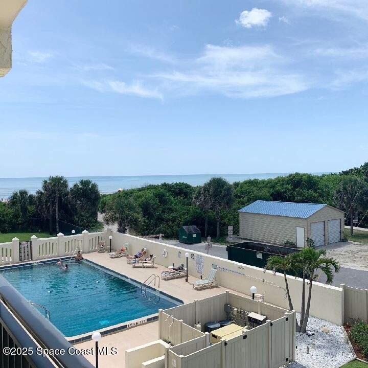 a view of a patio with a table and chairs
