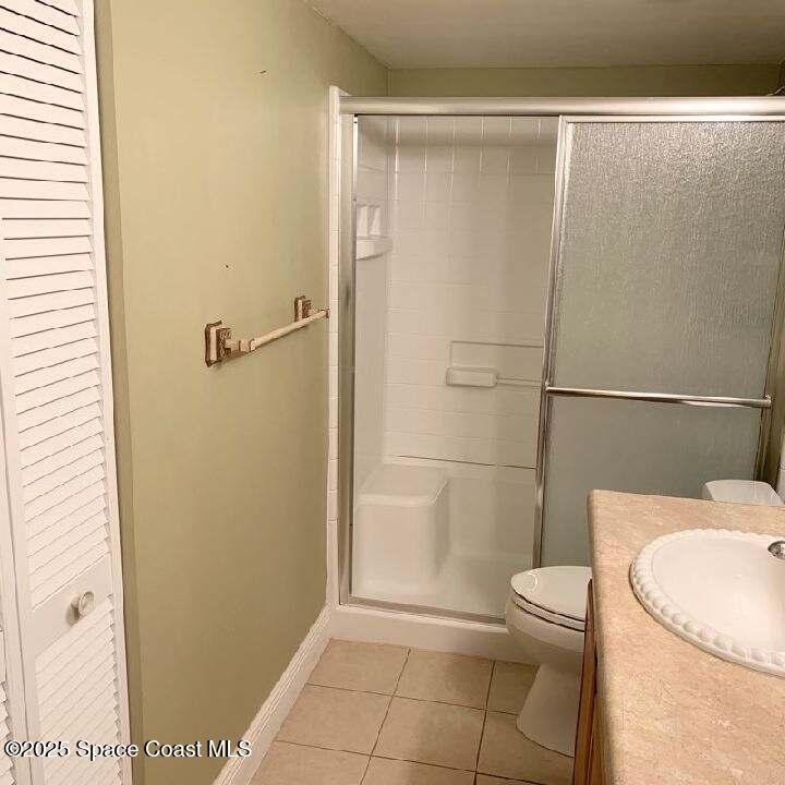 3060 North Atlantic Avenue, Unit 308 Cocoa Beach, FL 32931 - Photo 14 of 20 a bathroom with a toilet and a shower