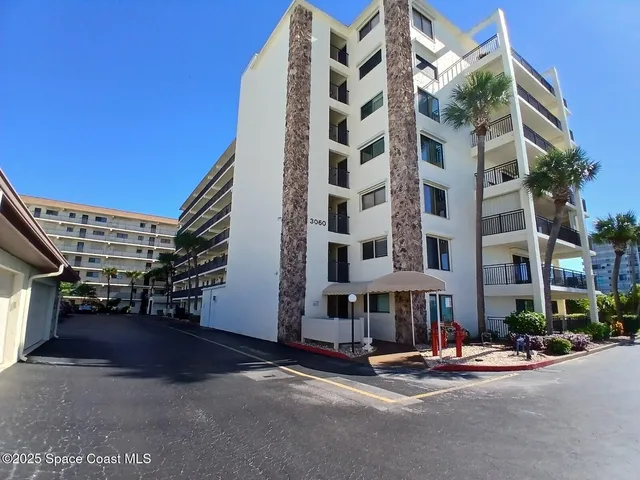 a front view of a building with street view
