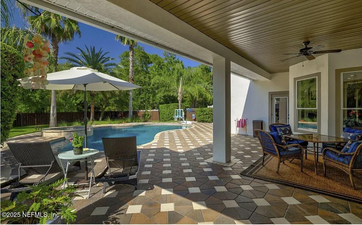 6119 White Tip Road Jacksonville, FL 32258 - Photo 10 of 83 Covered Lania looking out to pool
