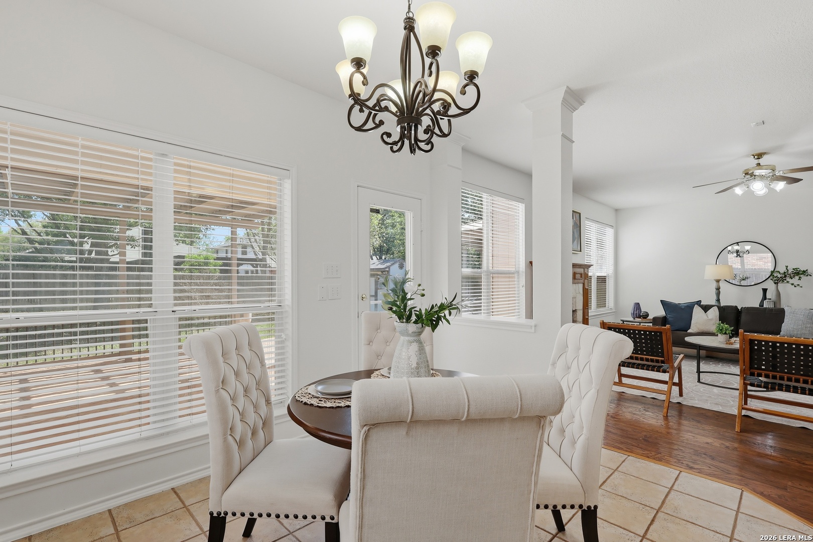 12910 Green Cedar Helotes, TX 78023 - Photo 15 of 65 a view of a dining room with furniture window and wooden floor